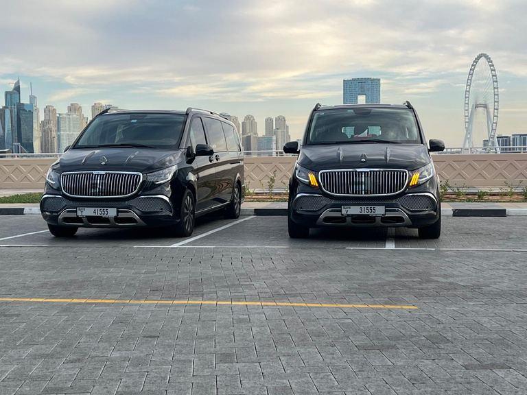 Two black luxury passenger vans in Dubai